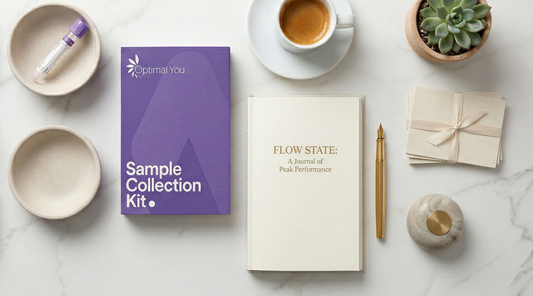 An Optimal You Blood Test Sample Kit with a coffee, book pen and empty blood vial.
