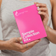 Person holding a pink 'Optimal You Sample Collection Kit' box.