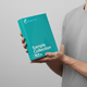 Person holding a teal 'Sample Collection Kit' from Optimal You against a gray background